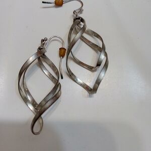 One pair of dangling twirling earrings ladies silver fashion